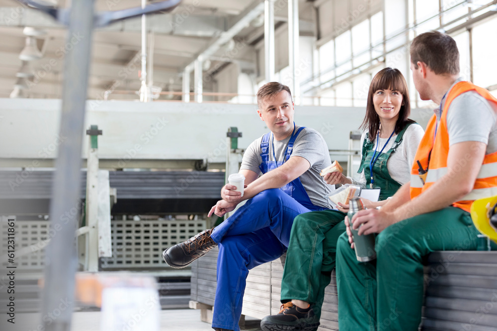 Sticker Workers enjoying coffee break in factory