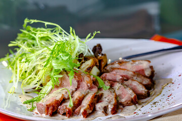 Roasted goose breast with caramelized pear