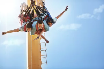 Deurstickers Friends bungee jumping at amusement park © KOTO