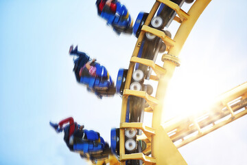 People flipping upside-down on amusement park ride