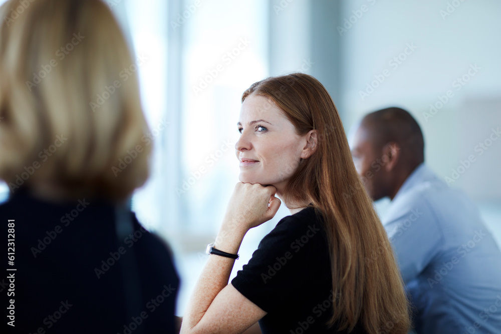 Wall mural Confident businesswoman listening in meeting