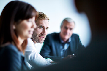 Businessman listening in meeting