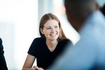 Smiling businesswoman in meeting