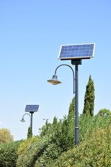 Street lamps with a solar panel in a public park in Athens, Greece.
