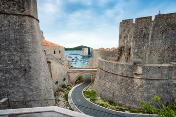 Fototapeta na wymiar Picturesque view over the bridge at the Eastern entry to Dubrovnik old town and the historical harbour beyond, Croatia.