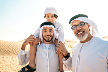 Three generation family making a safari in the desert of Dubai