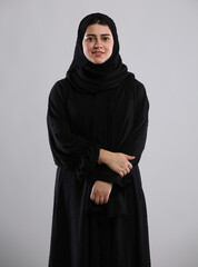 saudi arabian woman lady standing wearing  hijaab looking infront