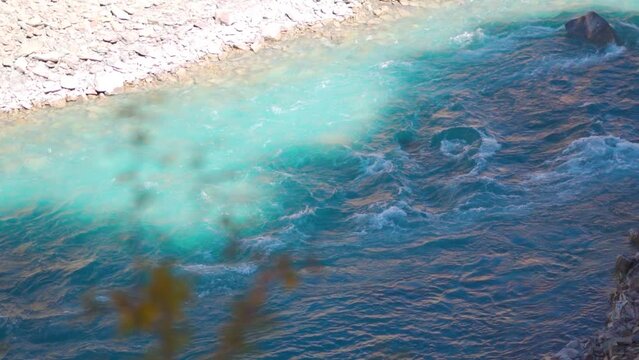 Blue Tsarap chu river flowing in the mountain valley of Zanskar as seen during the trek to Phugtal Monastery from Purne in Zanskar Valley, Ladakh, India. Beautiful blue river flowing in the Himalayas.