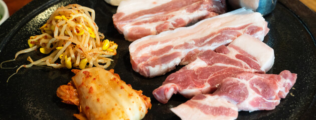 Fresh and delicious iron pan-fried black pork meal in Jeju Korean restaurant.
