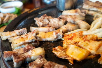Fresh and delicious iron pan-fried black pork meal in Jeju Korean restaurant.