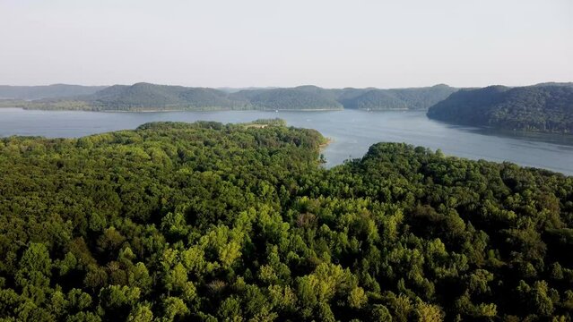 Drone flying over Daniel Boone National Forest towards Cave Run lake in Northeast Kentucky