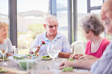 Senior couples enjoying patio lunch