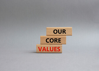 Our core values symbol. Concept words Our core values on wooden blocks. Beautiful grey background....