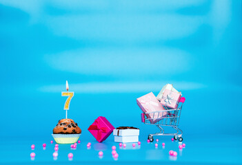 Creative card Happy birthday background for a girl or woman with a number of candles in a muffin...