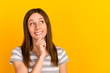 Photo of curious young lady touch chin dream imagine decide thoughts isolated on yellow bright...