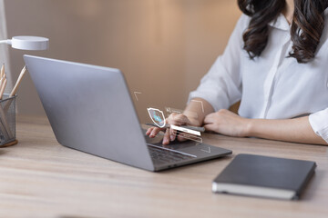 Businessman typing on keyboard laptop computer to input username and password for or technology security system and prevent hacker increases the security of your account concept.	