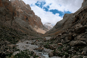 Mountain river between rock peaks