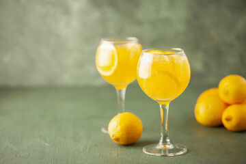 Homemade Limoncello spritz drink of liqueur, sparkling wine and lemon in cocktail glass