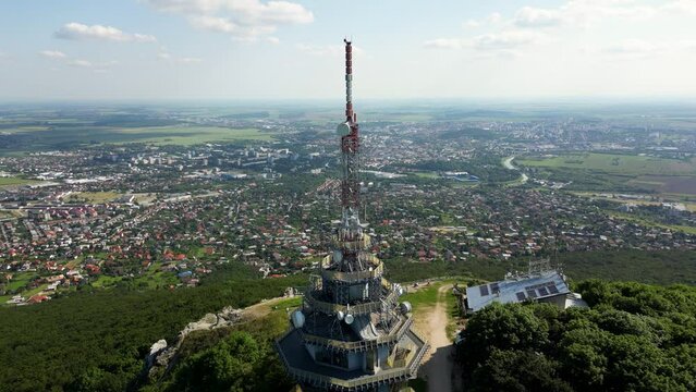 Massive radio tower on top of Zobor Mountain, cityscape of Nitra, Slovakia, 4k