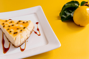 passion fruit cheesecake on yellow background