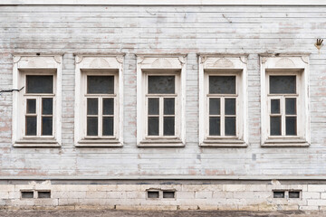 Fototapeta na wymiar facade with windows of an old house. old village house
