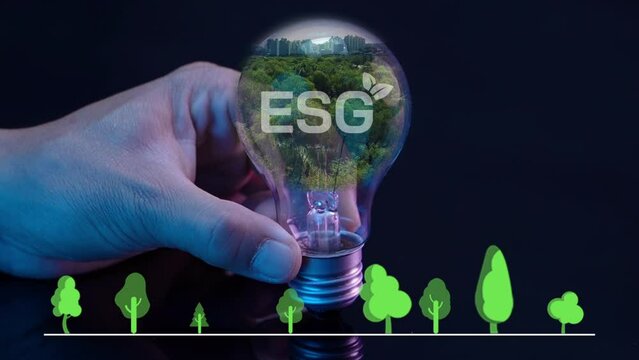 Light bulb with virtual tree and ESG icons. Net zero greenhouse gas emissions target. Climate neutral long term strategy. Ecological, renewable energy and save environment concept.