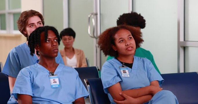 Diverse group of young students  seminar in lecture hall. Training courses. Medicine medical and health care concept