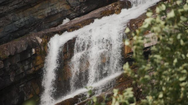 Water cascading from the rocks in the Waterton National Park. Slow motion. 