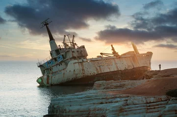 Fotobehang Schipbreuk Old ship Abandoned parking on the beach or Shipwreck off the Mediterranean