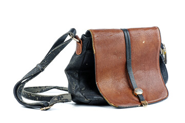 Women's handbag with damaged leather isolated on a white background