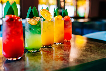 set Glass with tropical juice lemonafe with fruits on table