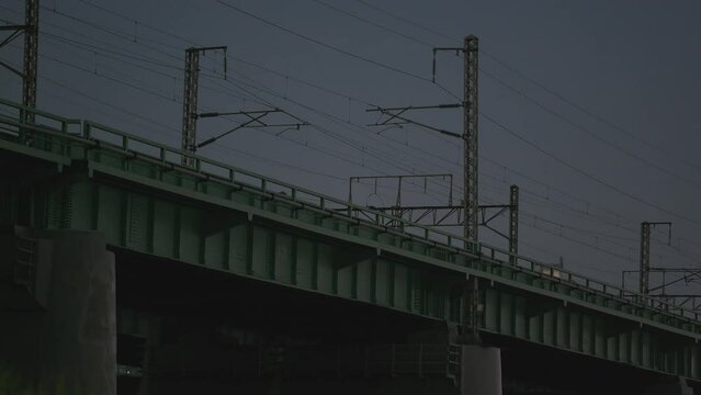 Night View of KTX Train Crossing Han River Railway Bridge in Seoul