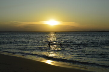 Sombra de banhista no Pôr do sol