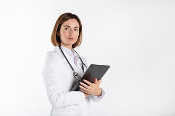 Young attractive female doctor standing with crossed arms and smiling isolated on white background	