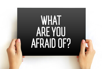 What Are You Afraid Of? text on card, concept background