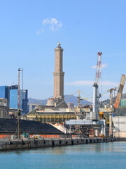 Fototapeta na wymiar Genoa port, Europe's 2nd largest port, with cranes, container ships and loading equipments.