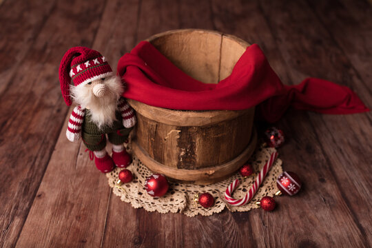 Christmas background for a newborn. A barrel with a decor for a child.New Year's decor.Natural wood.