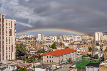 Fototapeta na wymiar Industrial city urban house sky rainbow rain.