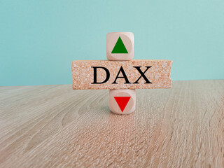 DAX price symbol. A brick block with arrow symbolizing that Deutsche Boerse DAX index price are...