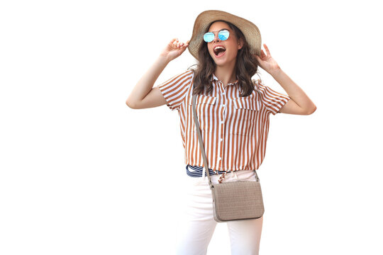 Smiling hipster trendy girl posing on a transparent background, holding hat.