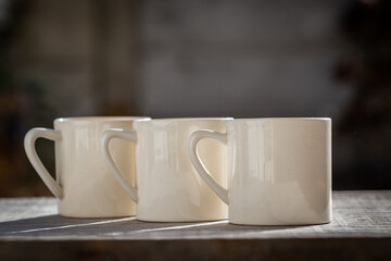 Hot tea in three mugs.