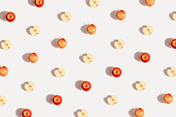 Creative pattern made of apple fruits on white background with shadow. Healthy food and vitamin concept. Minimal style. Top view. Flat lay