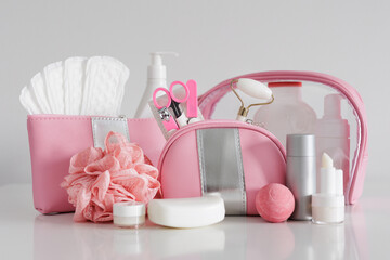 Set of women's personal hygiene products on white background