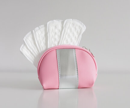 Daily cotton sanitary pads for hygiene protection in travel cosmetic bag