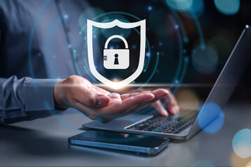 technology, business, firewall, security, guard, privacy, protection, safety, verification, shield. hand of businessman has guard safety protection is showing. other hand is typing keyboard for acess.