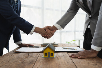 Handshake of real estate brokers with customers or investors, mortgage loan agreements Make a...