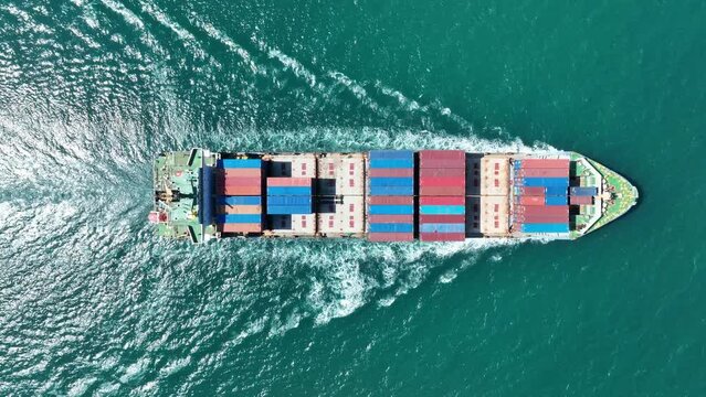 Cargo container Ship, cargo maritime ship with contrail in the ocean ship carrying container and running for export  concept technology freight shipping sea freight by Express Ship. top view 