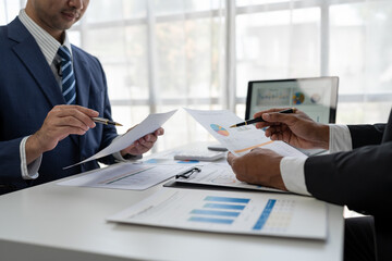 business people meeting in the office Calculate company tax and investment income Strategic planning and colleague brainstorming. Reports. Analyze charts. team work concept.