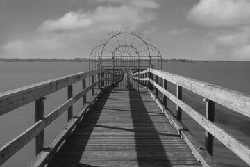 Fototapeta premium Dock with an ornate gate along the waterfront