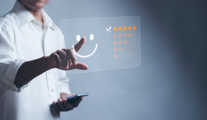 concept of satisfaction and customer service ,Man touching emoticons, smiley faces and stars on virtual screen Show excellent experience, highest satisfied from receiving good service